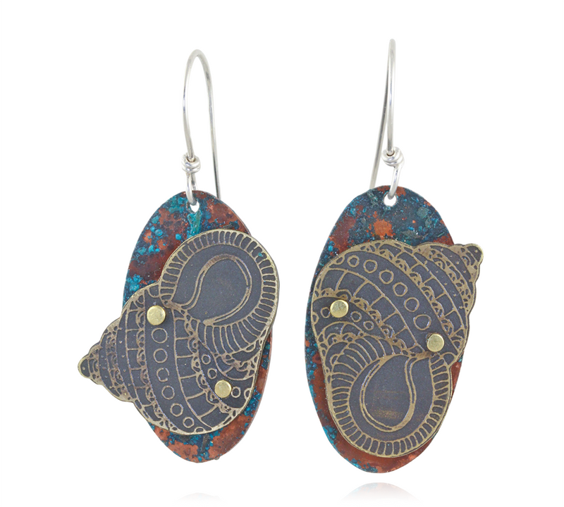 Pair of earrings with a seashell and intricate coloring on a white background- Front