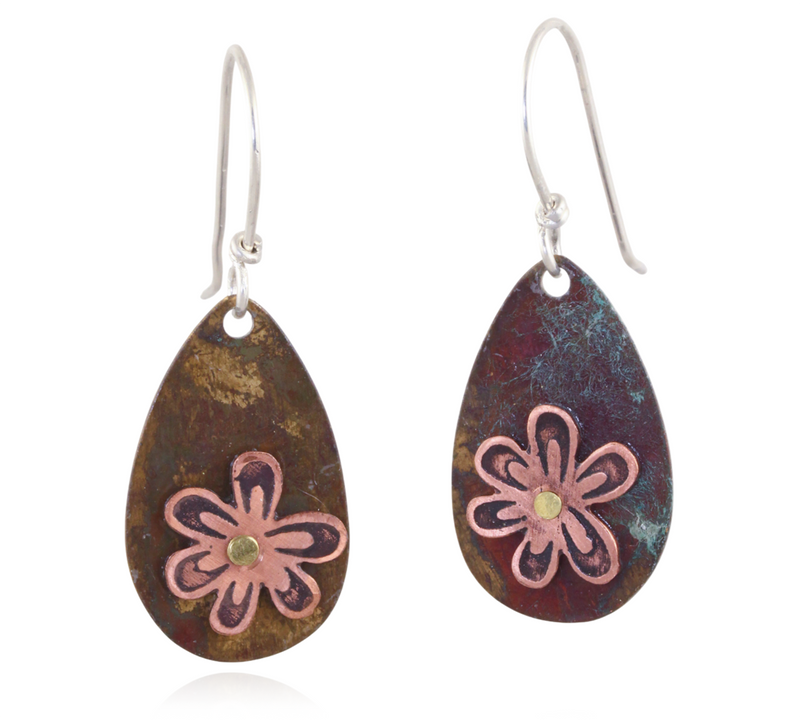 Teardrop-shaped earrings with copper wildflower on a white background.