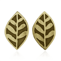 Pair of brass gold leaf-shaped earrings on a white background