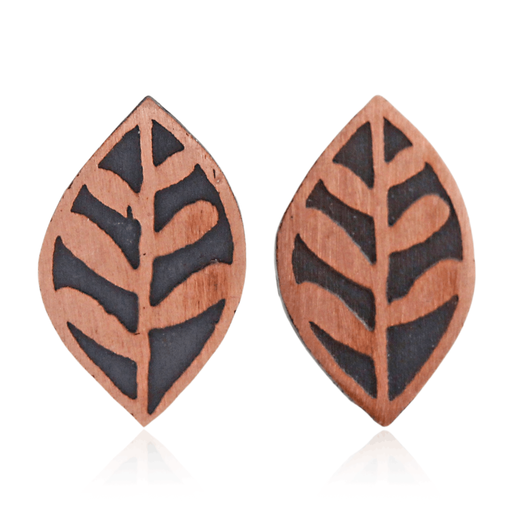 Pair of copper leaf-shaped earrings with black patterns on a white background