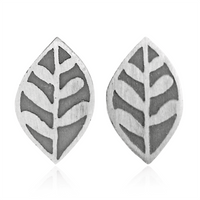 Pair of silver leaf-shaped earrings on a white background