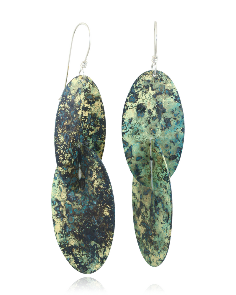 Pair of green and blue patterned earrings on a white background