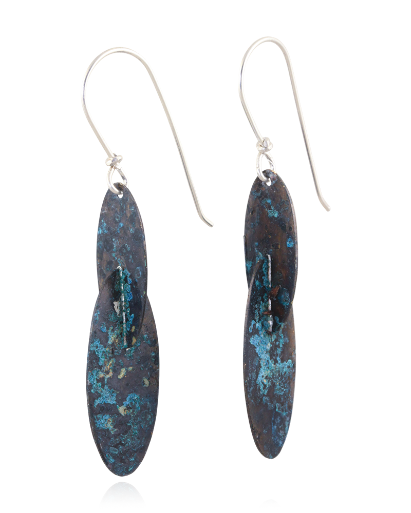 Pair of earrings with blue and gold speckled design on a white background