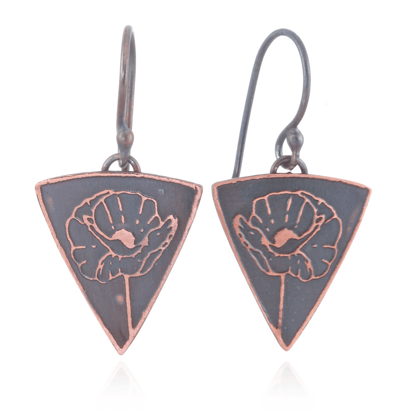 Triangular earrings with poppy floral design on a white background