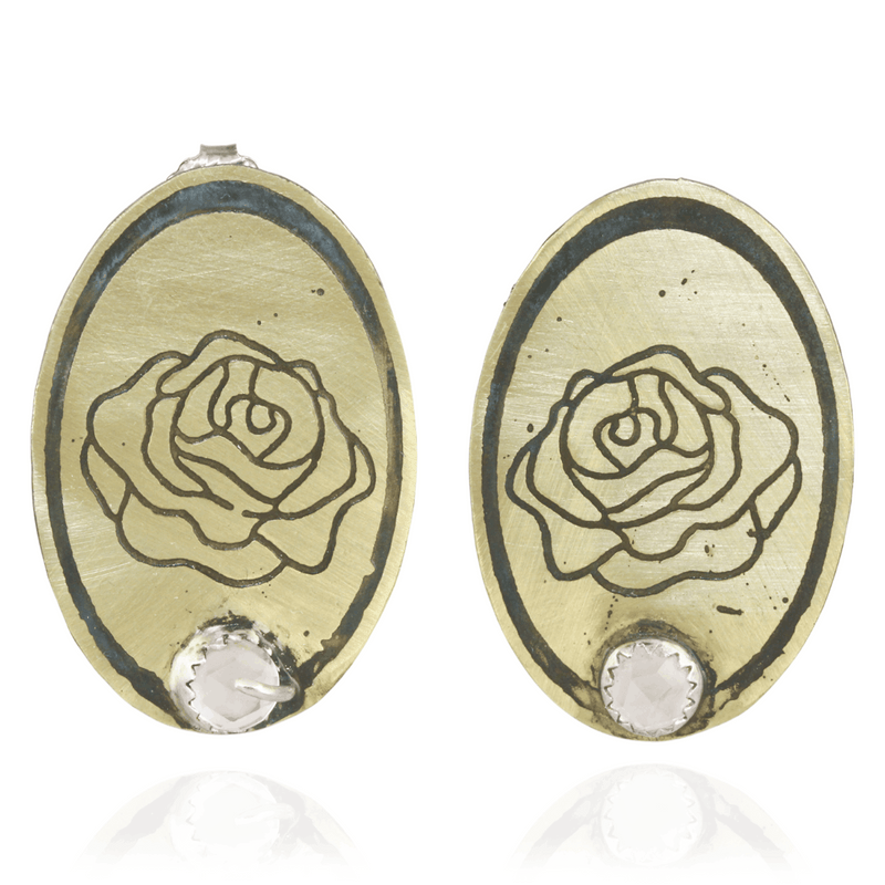 Nu gold pair of oval shaped earrings with rose design and rose quartz gemstone on a white background
