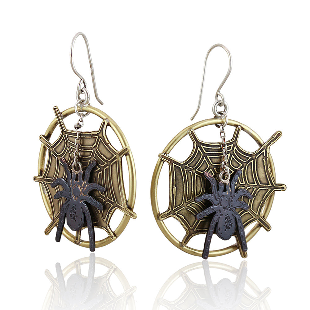 Front of spider web designed statement dangle earrings with moveable spider element.