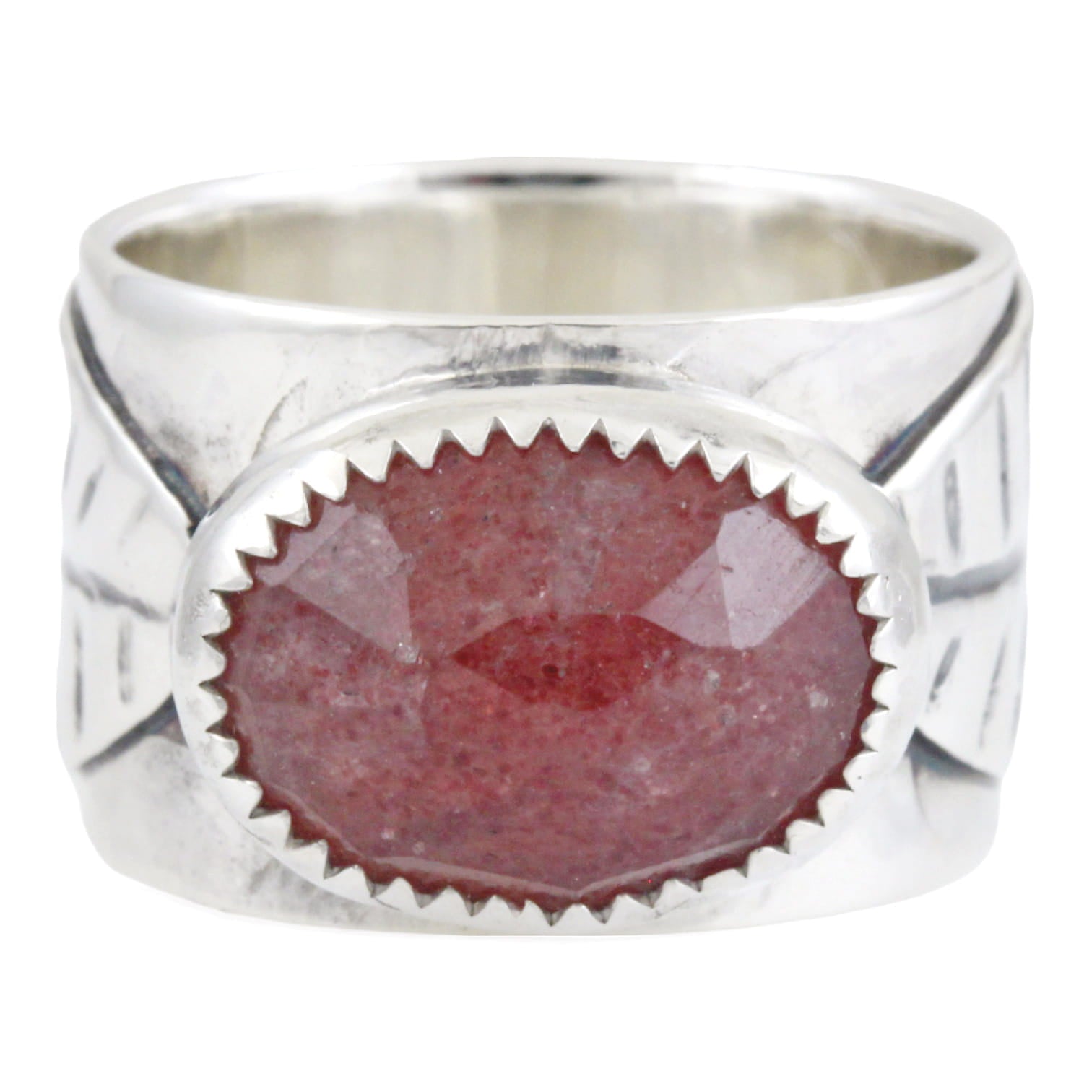 Silver ring with a pink oval stone on a white background