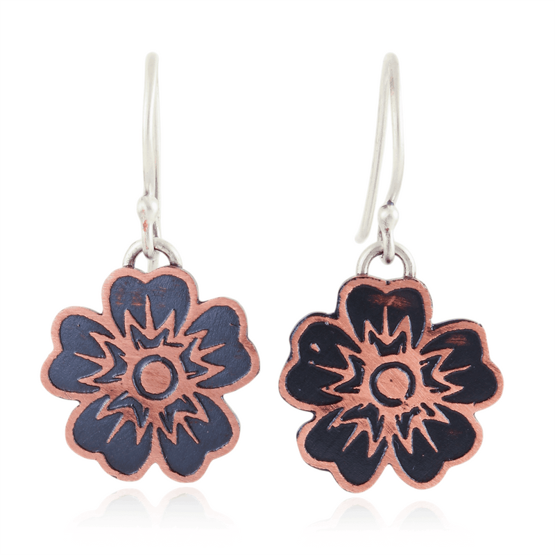 Floral earrings with copper and silver design on a white background