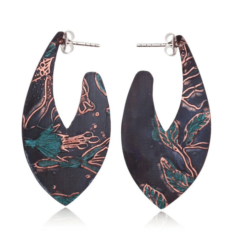 Pair of earrings with floral patterns on a white background