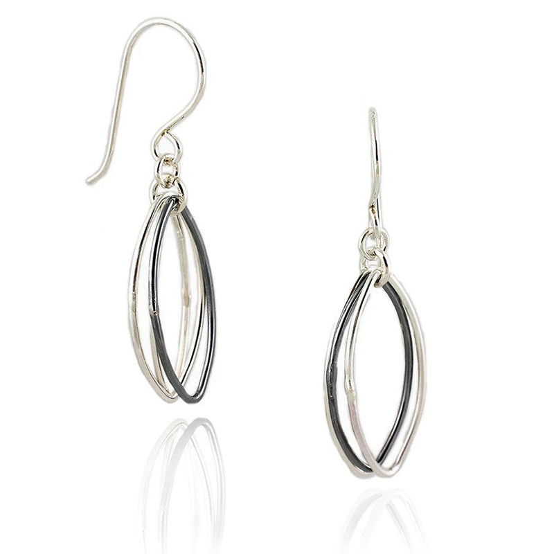 Two-toned abstract leaf dangle earrings in sterling silver, featuring oxidized and polished elements. V2