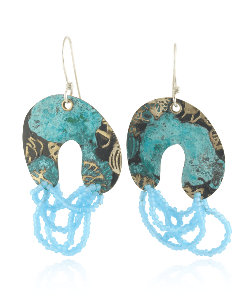 Colorful arch shaped dangle earrings with matte light blue beads on a white background.