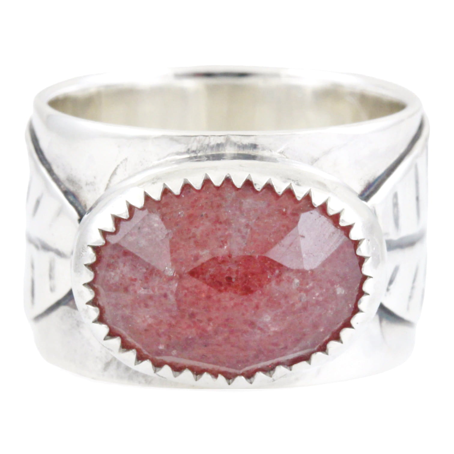 A silver ring featuring a large, faceted oval pink stone with a scalloped silver border, two leafs on the ring band sides, set against a plain white background.