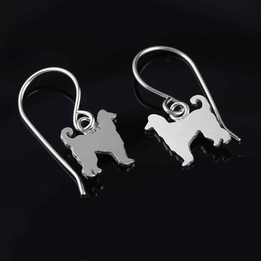 Sterling silver Afghan Hound dangle earrings with hand-sawed dog silhouettes and polished finish on white background.