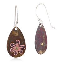 Teardrop-shaped earrings with copper wildflower on a white background.