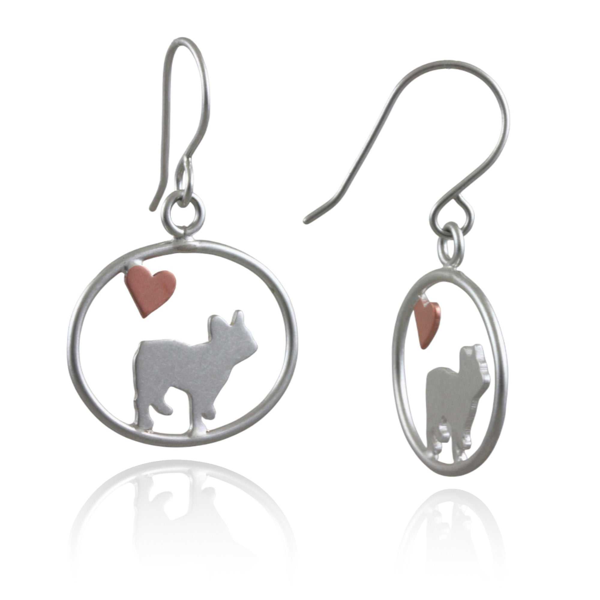 Sterling silver French Bulldog dangle earrings with copper heart inside oval frame, matte finish on white background.