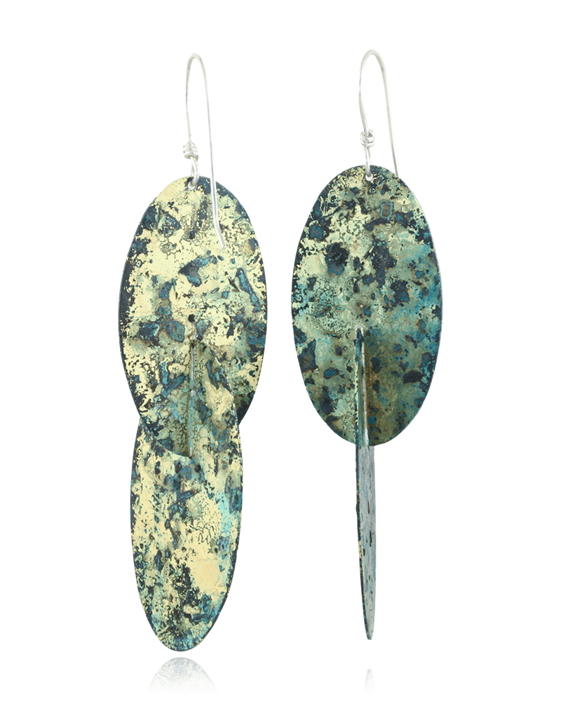 Pair of earrings with green and blue speckled design on a white background