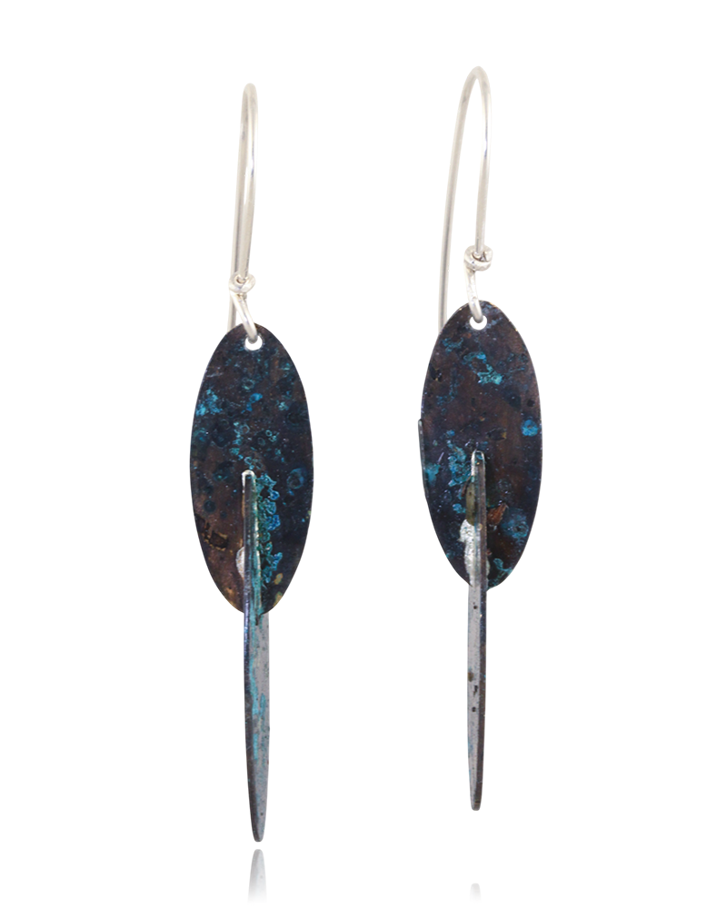 Pair of earrings with blue and gold speckled design on a white background