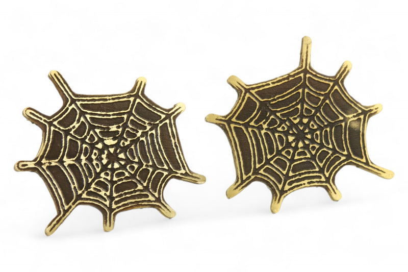 Front angled view of brass spider web earring studs.