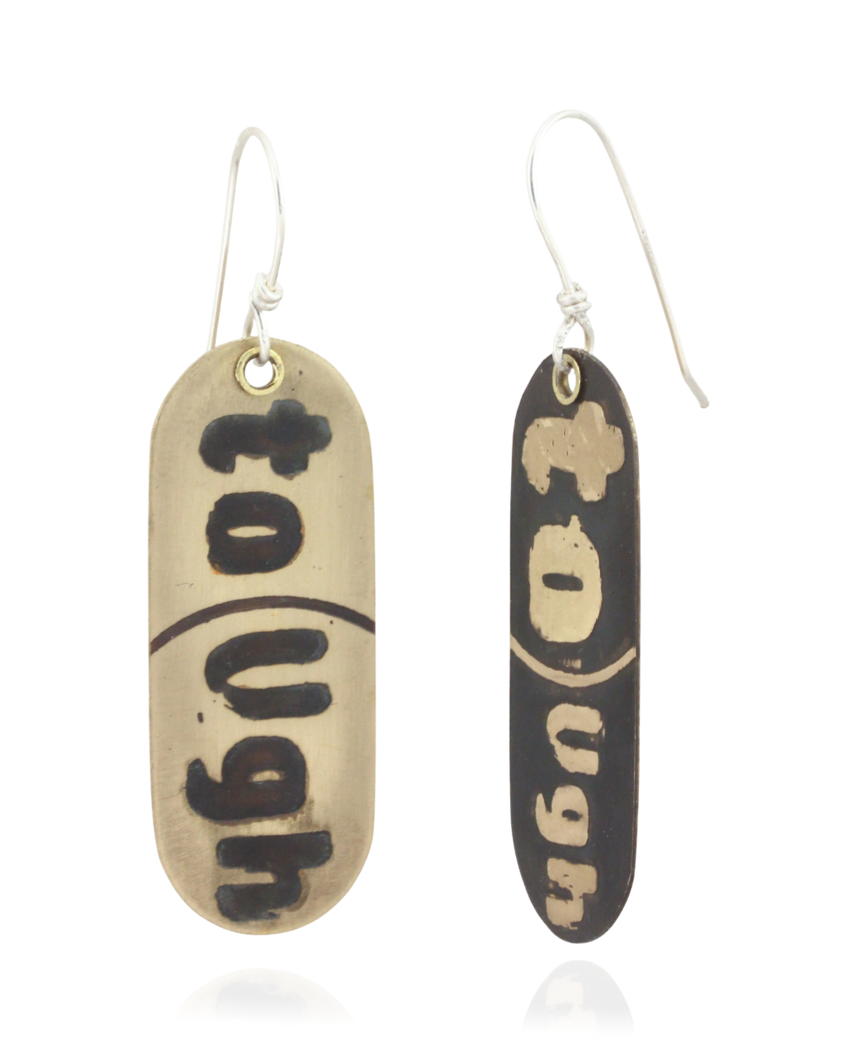 Pair of handmade brass earrings with 'Tough' text on a beige and black background. Front and Side View