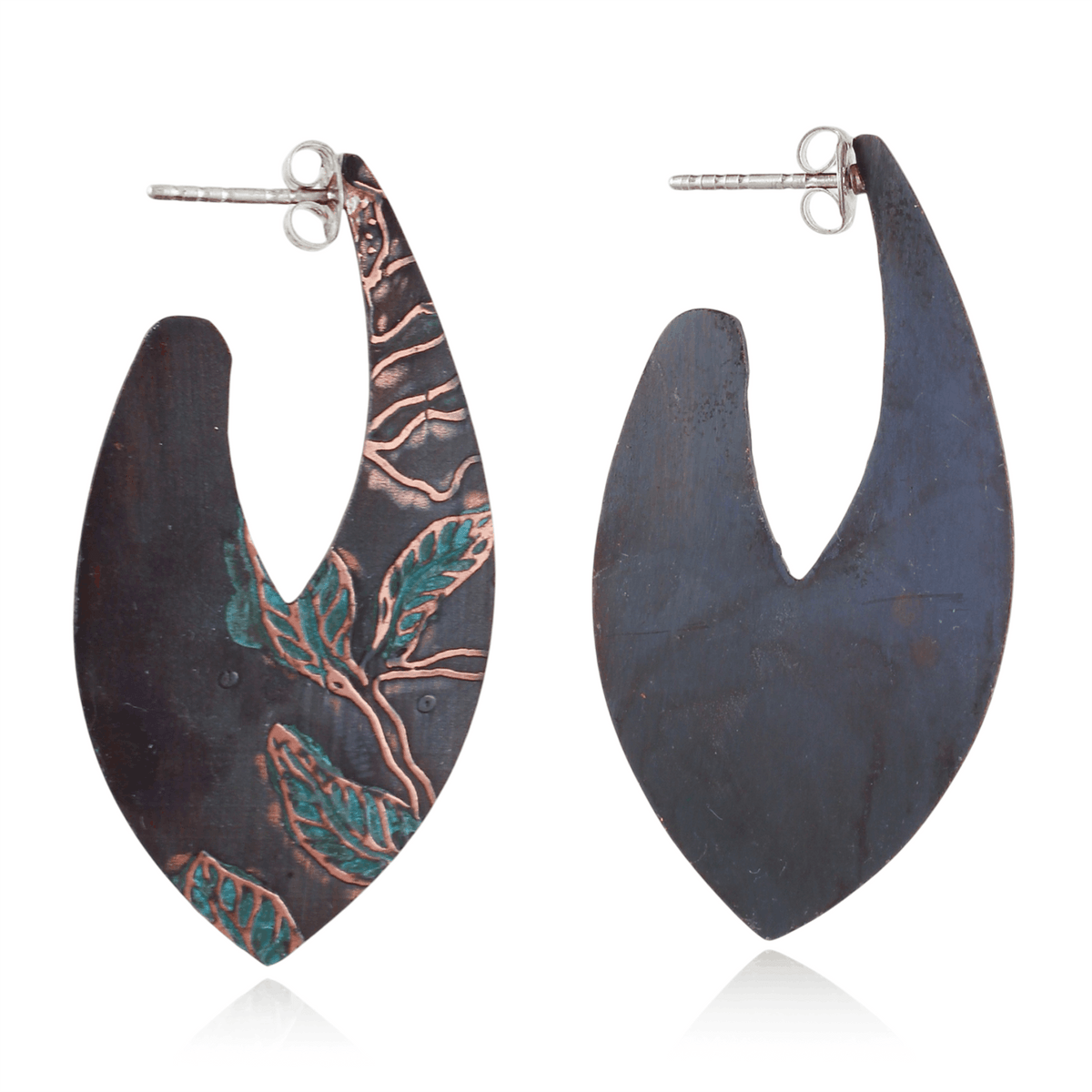 Pair of earrings with floaral leaf design on a white background