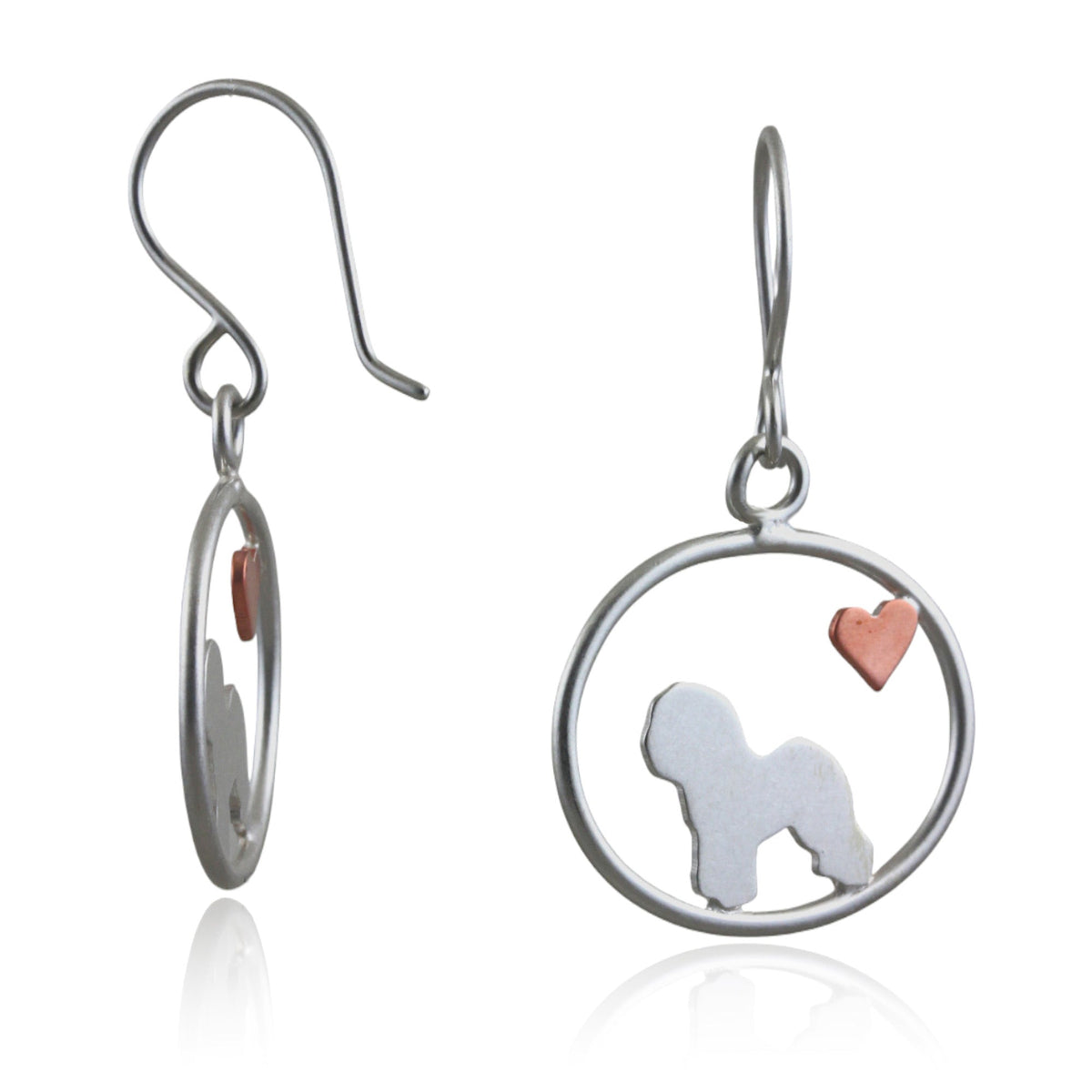 Bichon Frise dangle earrings with sterling silver silhouette and small copper heart in oval frame on white background