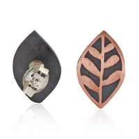 Pair of leaf-shaped earrings on a white background