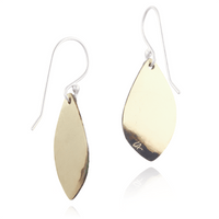 Gold teardrop earrings on a white background