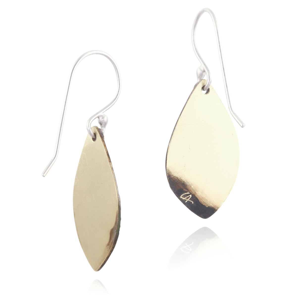 Gold teardrop earrings on a white background