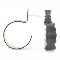 Black and gold hoop earrings with a interlocked teddy bear pattern on a white background.
