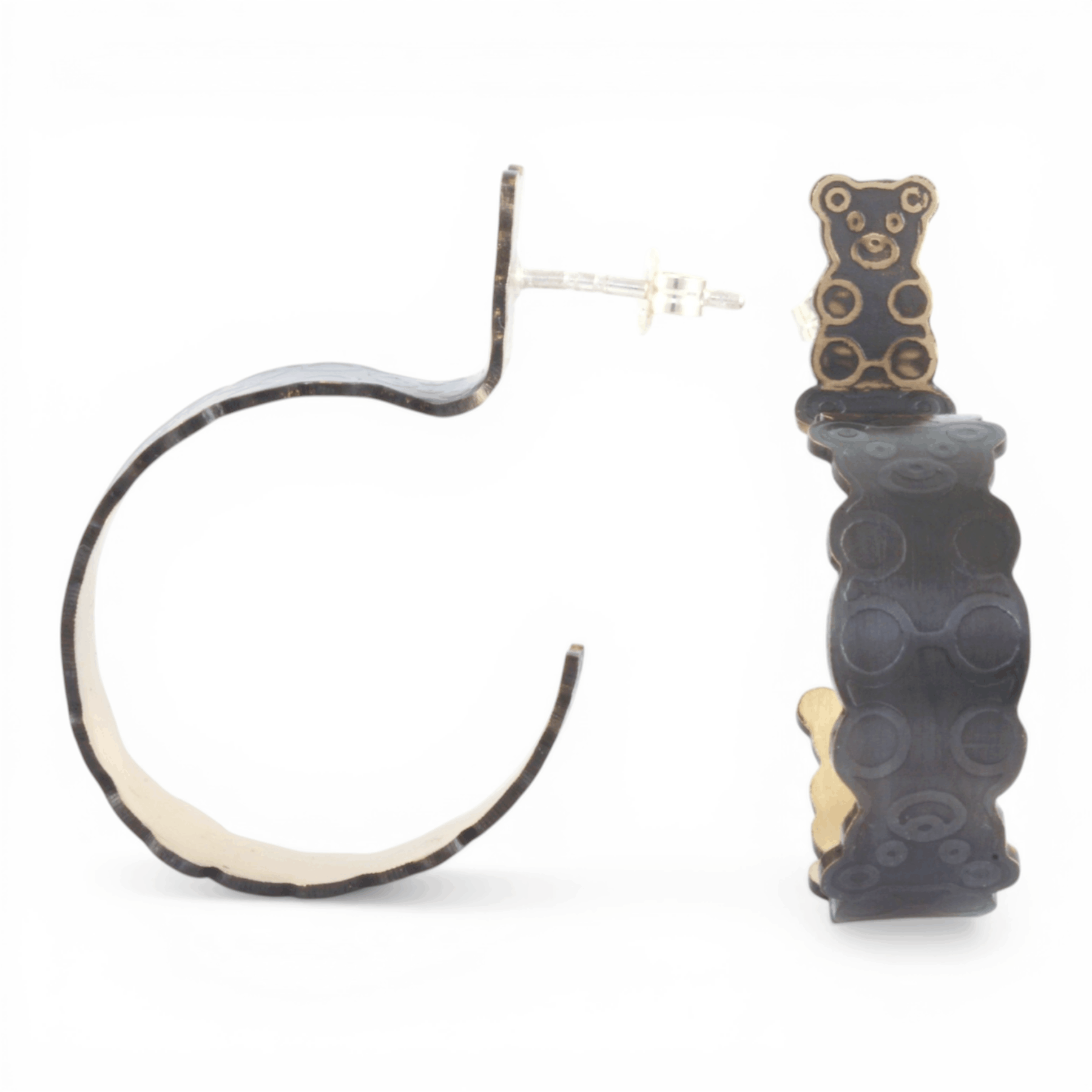 Black and gold hoop earrings with a interlocked teddy bear pattern on a white background.