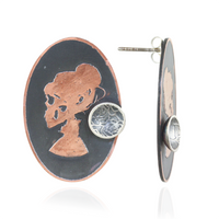 Oval pair of earrings with copper skull silhouette with a mini silver cup design  on a white background.