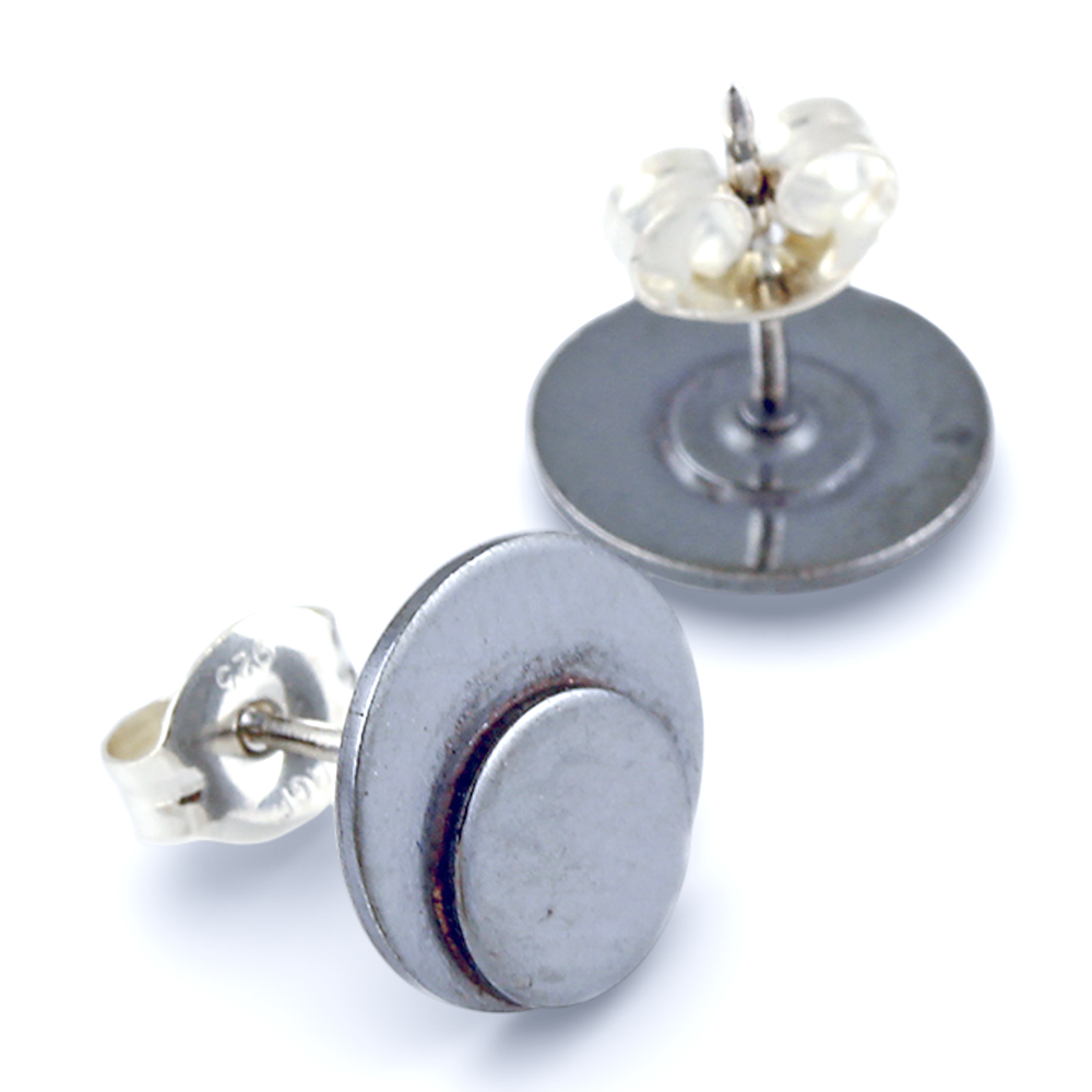 Oxidized sterling silver polka dot button earrings on a white background.