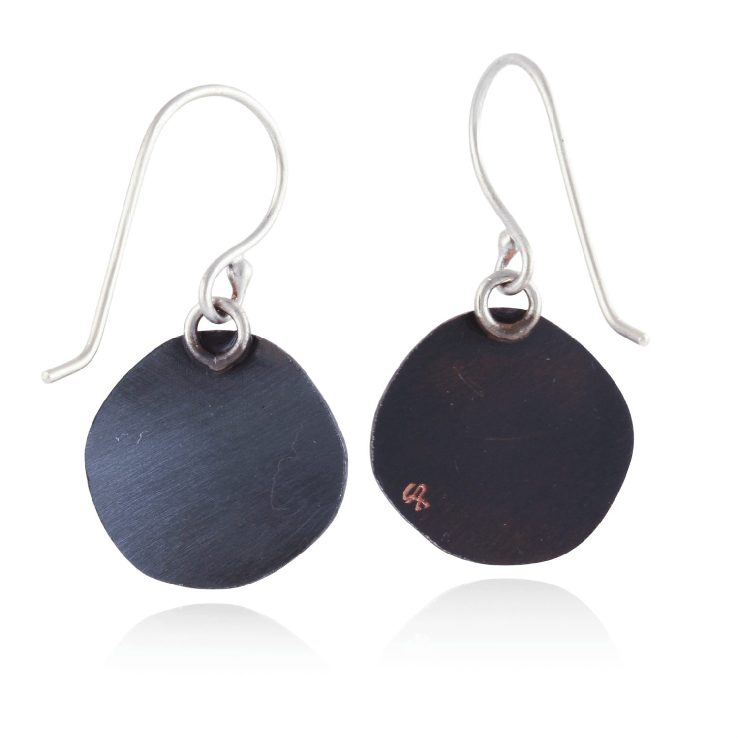 Black round earrings with silver hooks on a white background