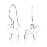 A pair of silver drop earrings featuring dog-shaped charms, displayed on a clean white background with a subtle reflection below.