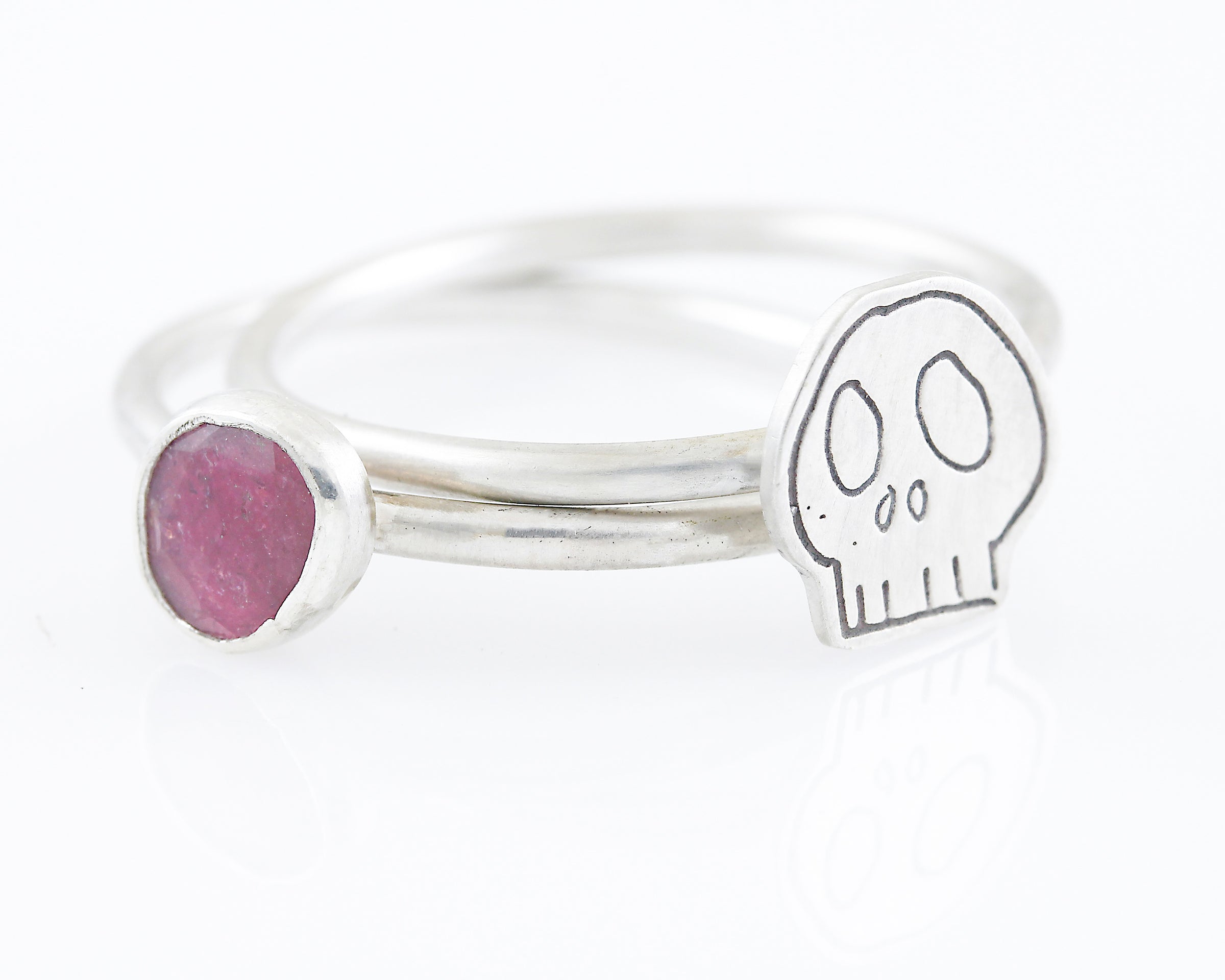 Pink Tourmaline Skull Stackable Ring: Size 10.5 by Creative Dexterity. Front View laying flat
