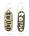Pair of handmade brass earrings with 'Tough' text on a beige and black background. Front View