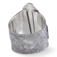 A silver-toned metal ring with a textured, hammered exterior and a polished, reflective interior, shown on a plain white background.