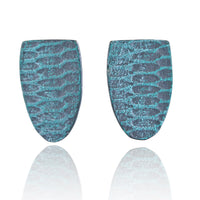 Front view of two aqua-teal shield shaped earrings with a mod uniform snakeskin pattern on a white background.