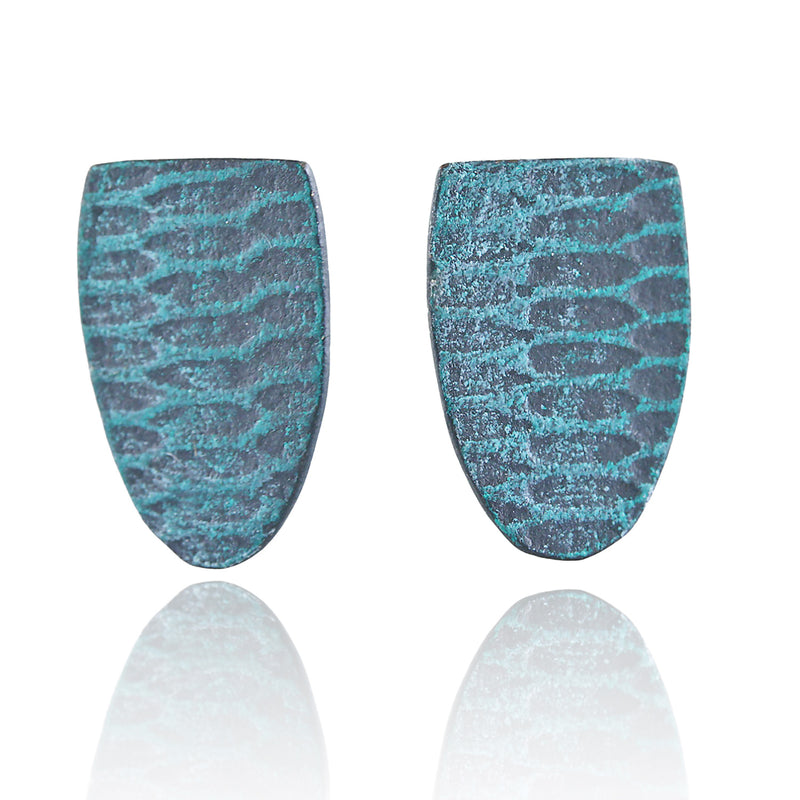 Front view of two aqua-teal shield shaped earrings with a mod uniform snakeskin pattern on a white background.