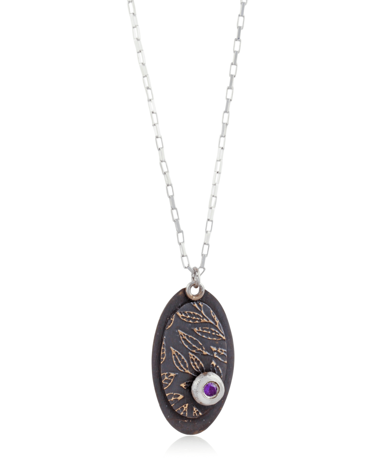 Necklace with an oval pendant featuring a leaf pattern and purple amethyst gemstone on a white background