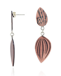 A pair of handmade dangle earrings featuring copper-colored wooden beads with black hand-painted patterns, shown on a clean white background.
