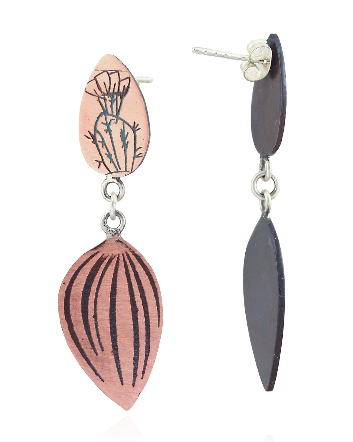 A pair of handmade dangle earrings on a white background. One earring is shown from the front, featuring a copper-colored top oval piece with a black hand-drawn botanical design, connected to a larger leaf-shaped drop piece with black vertical stripes.
