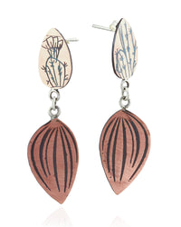 A pair of handmade drop earrings featuring a terracotta-colored top piece engraved with a cactus design, connected by silver rings to a larger, ribbed terracotta-colored teardrop-shaped piece below, set against a plain white background.