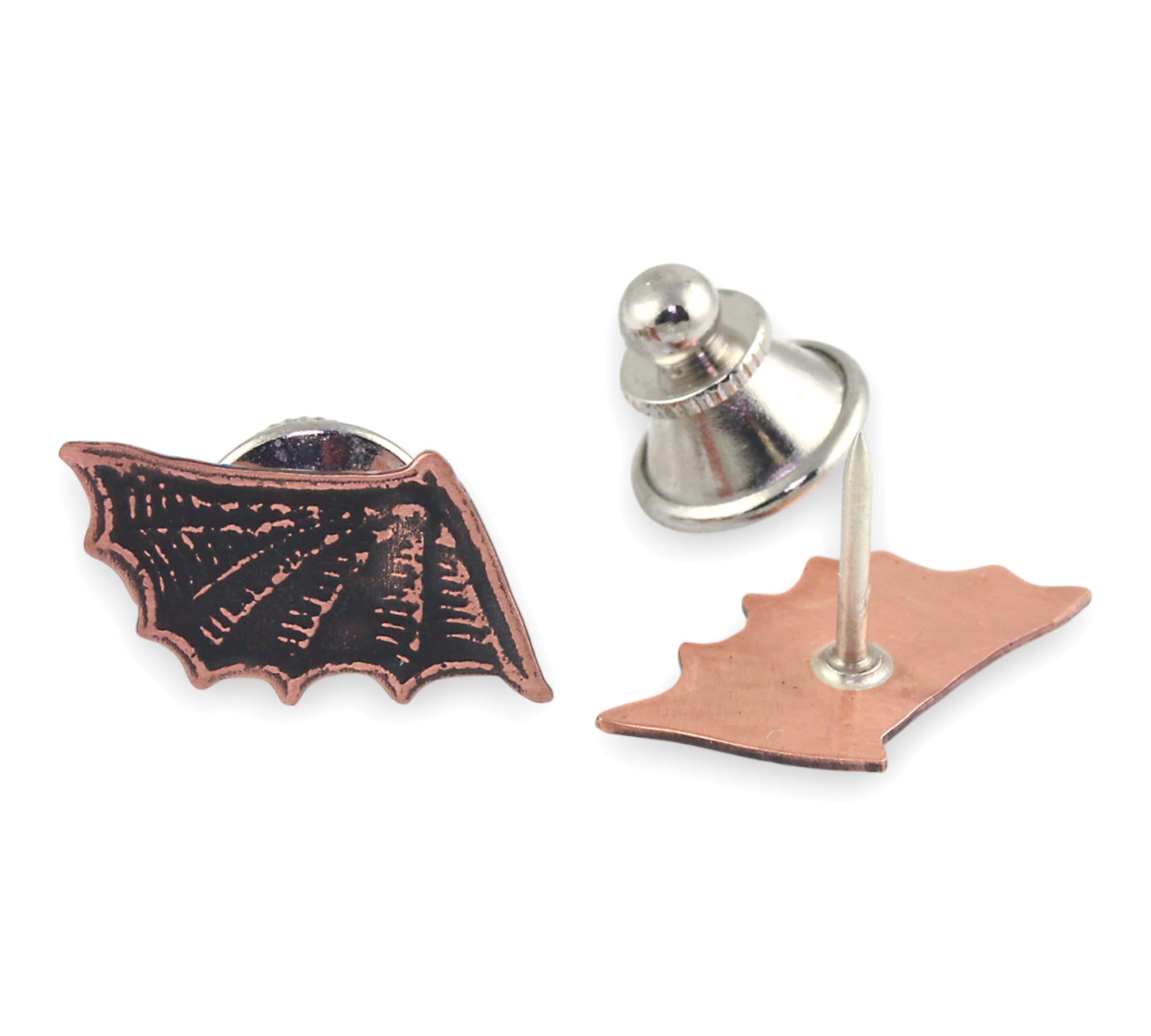 Copper Bat-shaped pin on a white background