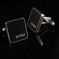 Black square cufflinks with 'enter' text on a black background