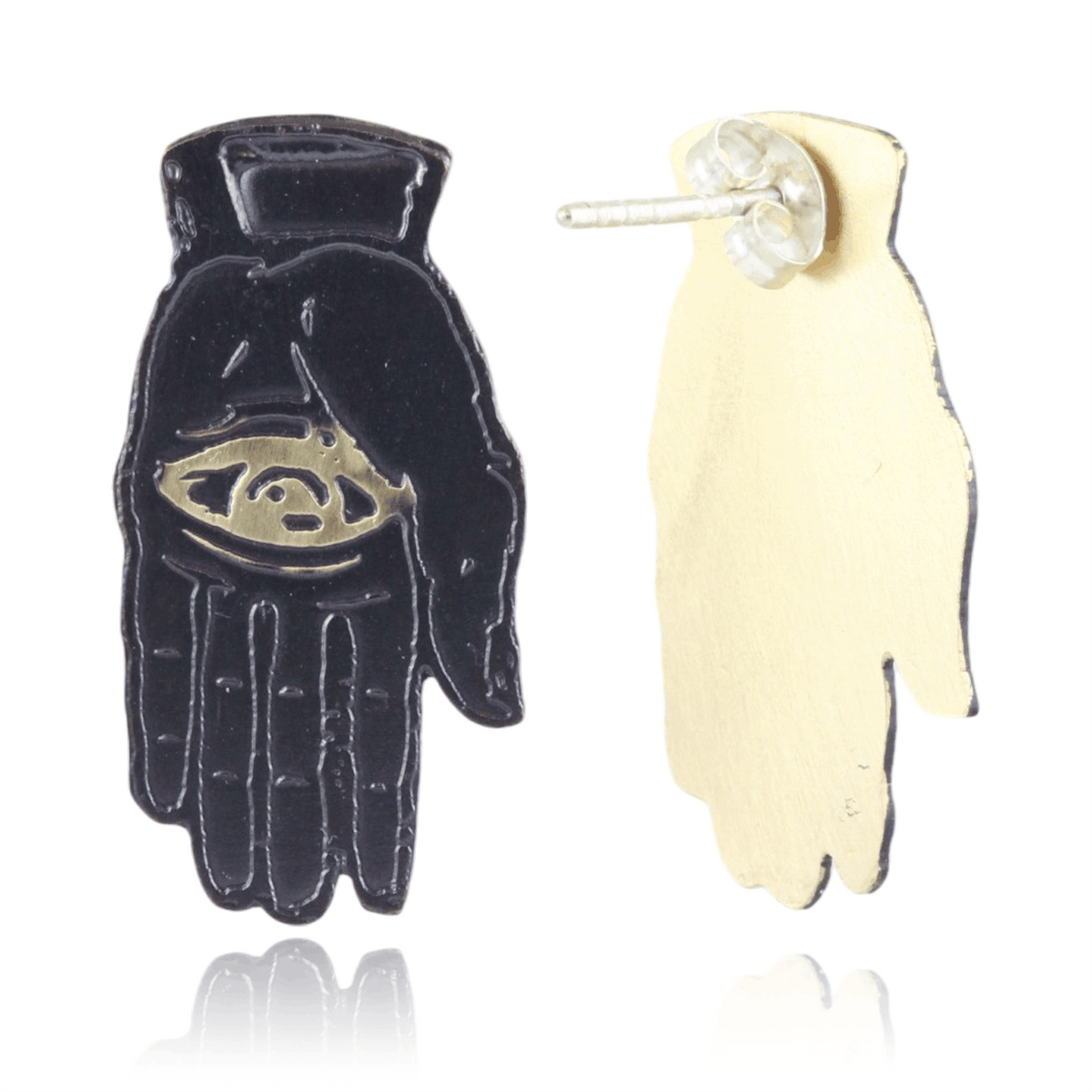 Slate colored palm with gold eye design and back of earrings on a white background.