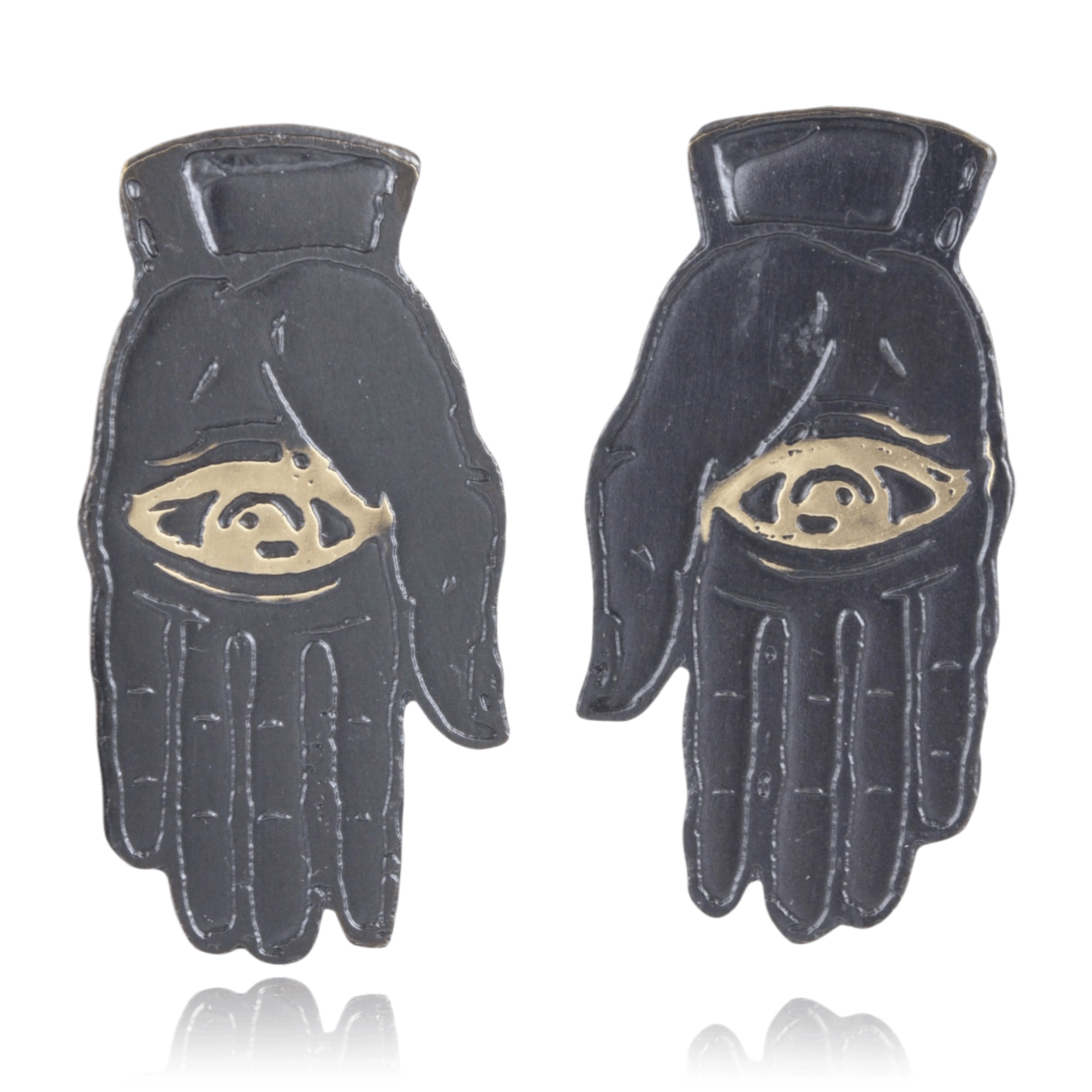 Slate colored palm with gold eye design on a white background.