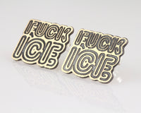 Two metallic 'FUCK ICE' earrings on a reflective background. Front Side View