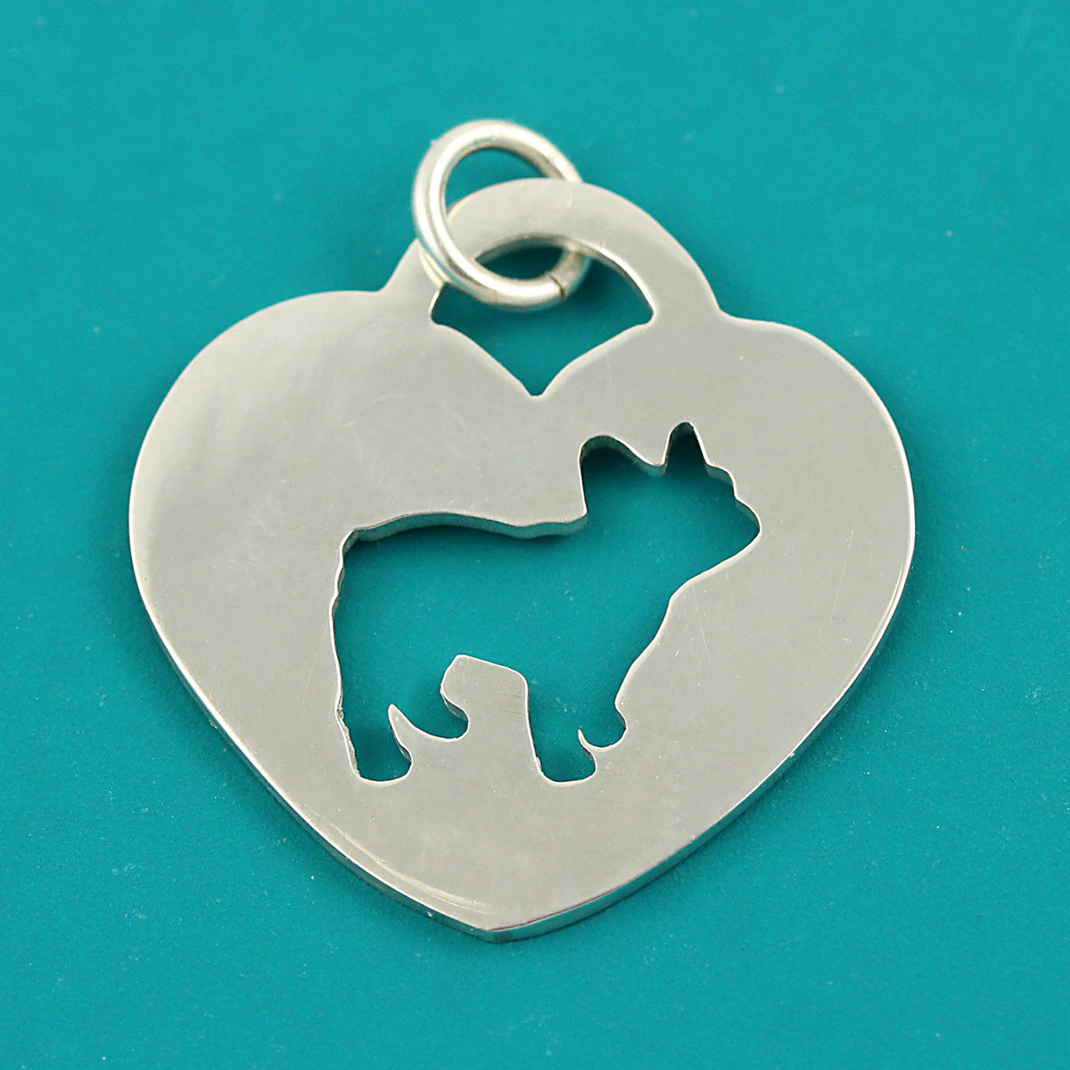 Handmade sterling silver french bulldog heart charm.
