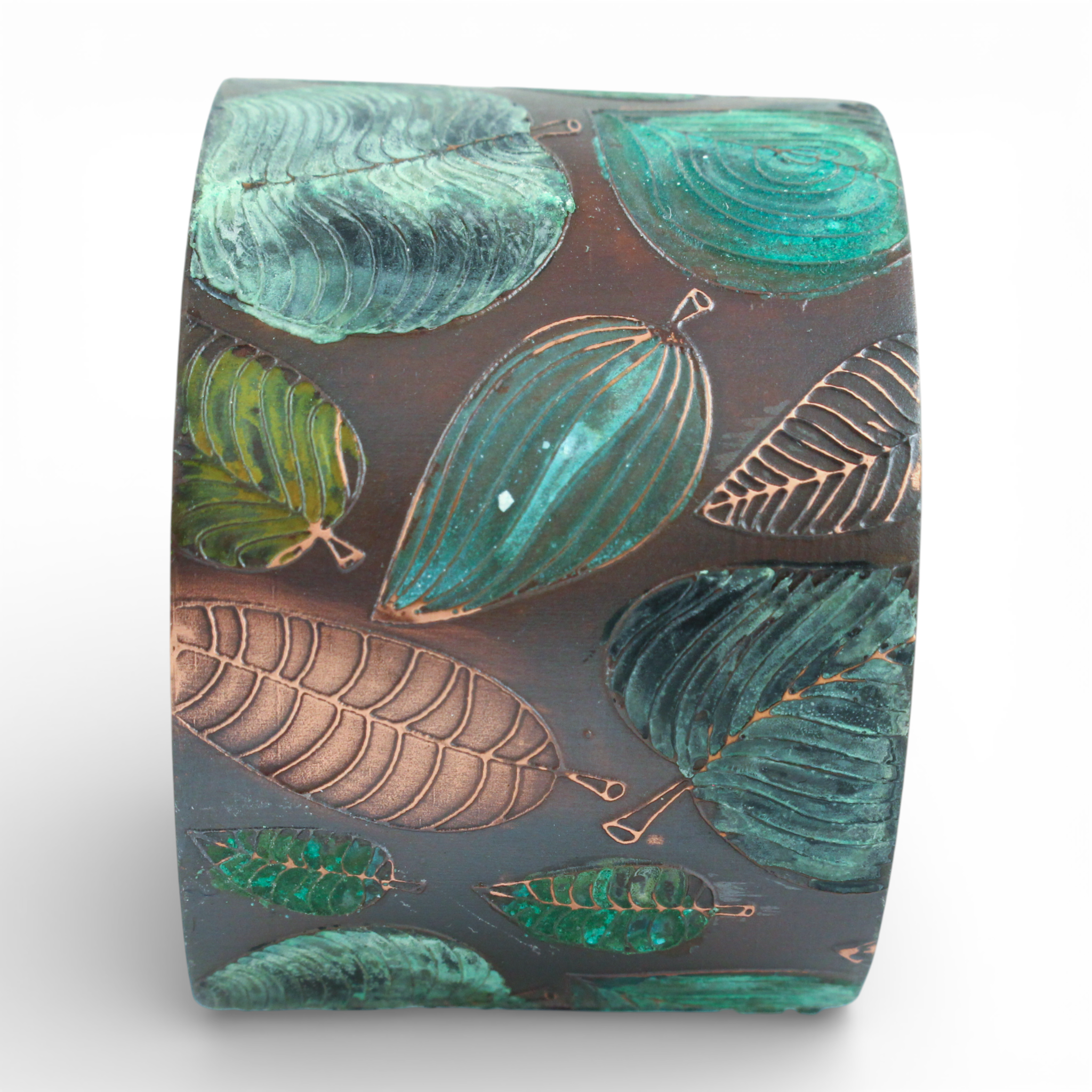 Metal cuff bracelet with green leaf pattern on a white background